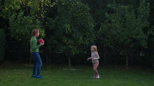 Playing Edible or Inedible Game with Siblings in the Backyard