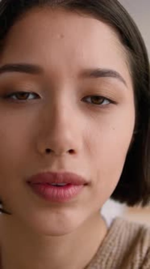 POV Webcam Hispanic Woman at Home Using Smartphone Touchscreen Scrolling Photo Point of View Latino