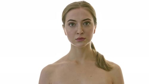 Young Woman with Blond Hair Looking at Camera