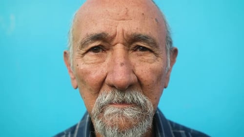 Close up of senior man looking into the camera - Elderly people lifestyle concept