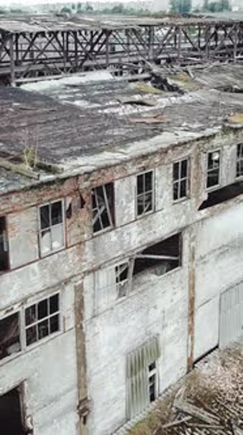 Abandoned ruined industrial factory building, ruins and demolition concept. Aerial view.