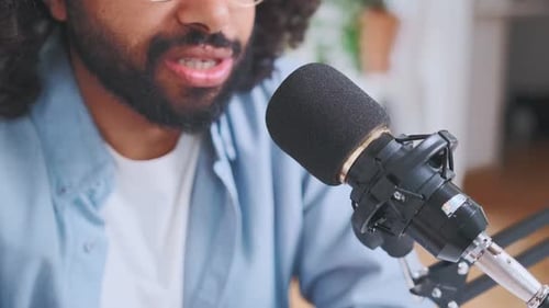 Closeup of Microphone and Mouth of Young Bearded Arabian Man Blogger