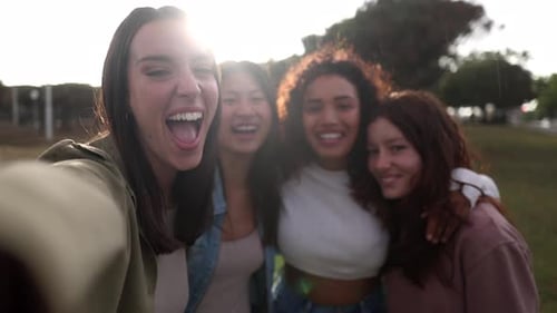 Smiling selfie of a cheerful group of young people. Video call of excited happy friends having fun.