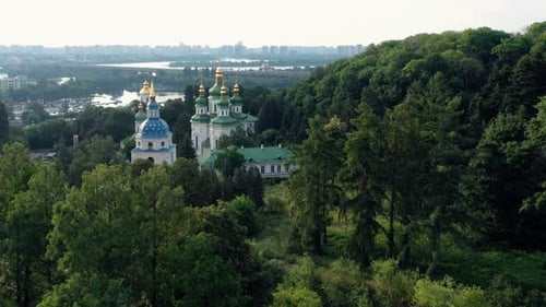 Landscape of Orthodox Church with River and Green Trees