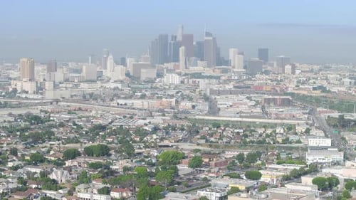 Early Foggy Morning Flight Over Los Angeles City Towards Downtown Buildings USA