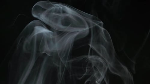 Swirling White Smoke on Black Background