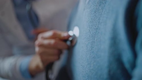 Cropped View of the Woman Doctor Holding Stethoscope and Checking Breath Sound