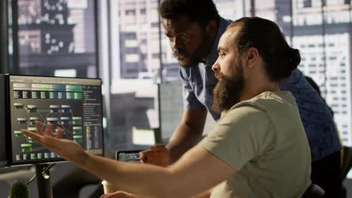 Team Leader Supervising IT Staff Member Optimizing Code