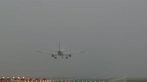 Airplane Emerging for Landing
