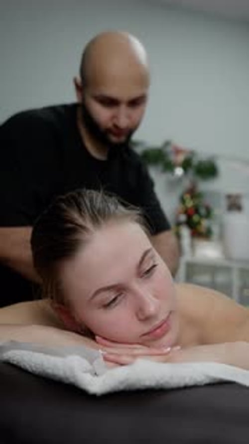 Woman Receives Back Massage