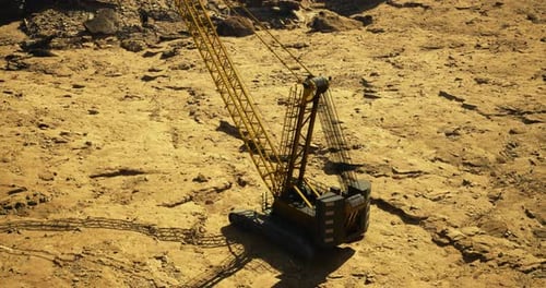 Heavy Construction Machinery Working on Rocky Terrain During Daylight