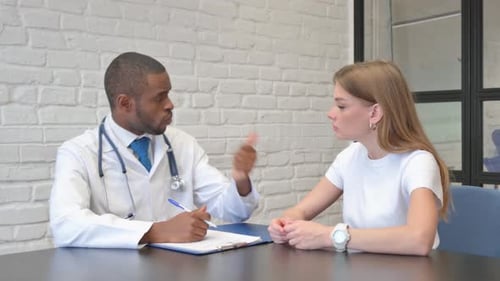 Doctor and Patient Discussing Medical Condition