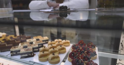 Portrait Confident Female Bakery Owner Standing at Pastry Display Case 10 Seconds or Greater