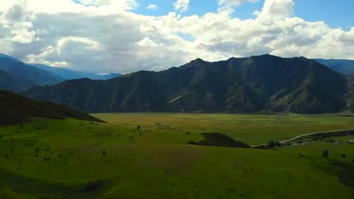 Mountain Valley Landscape with Moving Cloud Shadows Media