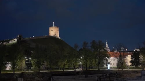 Illuminated Castle Tower at Night in Vilnius
