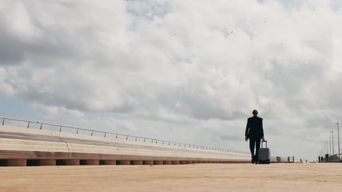 Tourist Man with Suitcase Baggage in Spain A Traveler with Luggage Suit Jacket on Business Street Go