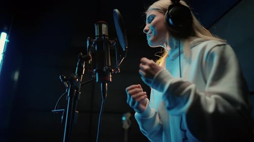 Modern Sound Studio for Recording Music Portrait of Singing Woman Singer Record of Soundtrack