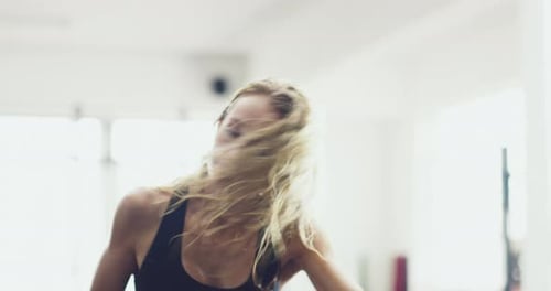 Fitness, exercise and training woman on sports bike workout in health and wellness gym center.