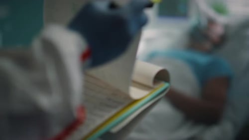 Nurse Hands Holding Clipboard Checking Medical Records In Hospital Ward Closeup. Sick African Ame...