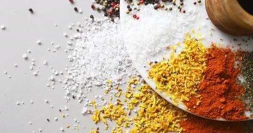 Colorful Spices Arranged on a White Surface