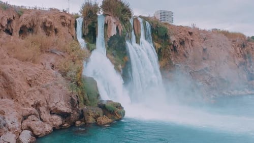 Stormy Waterfall on a Rock in a Tourist Place