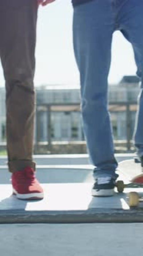 Skateboard, fitness and legs of friends on ramp in skatepark for extreme sports