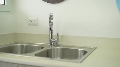 white kitchen sink with two sinks