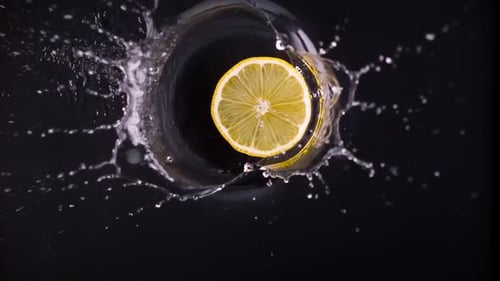 the Lemon Falls Very Slowly Into the Water