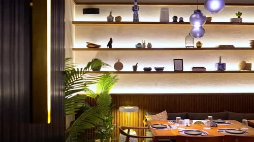 Front view of stylish and light dining room wide shot, push in shot, pull out shot