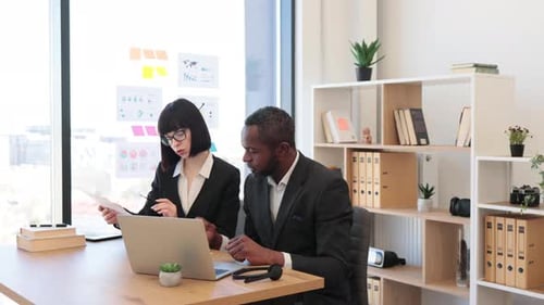 Diverse Office Workers Having Video Call on Laptop at Office