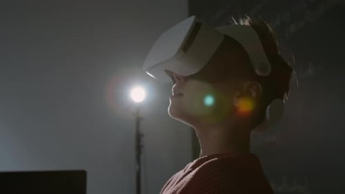 Schoolboy Using VR Headset while Working with Computer Code at Lesson