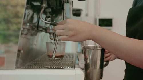 Barista is making coffee in coffee shop