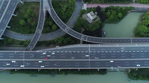 Aerial Drone View of Highway Multilevel Junction Road with Moving Cars at Sunset Cars are Moving on