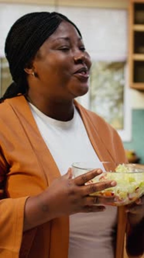 Woman Smelling and Talking About Her Salad