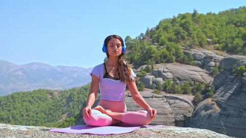 Woman Practicing Yoga Stretch in Nature with Mountain View Outdoors
