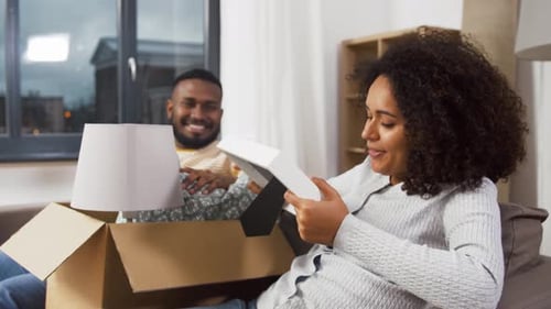 Moving, People, Repair and Real Estate Concept - Happy African American Couple