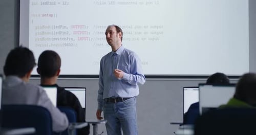 Teacher Giving Coding Lesson in Classroom