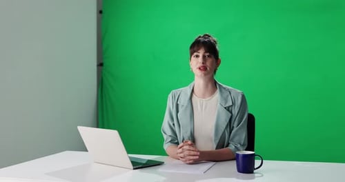 Talking, woman and journalist with breaking news, green screen or reporting live for global updates