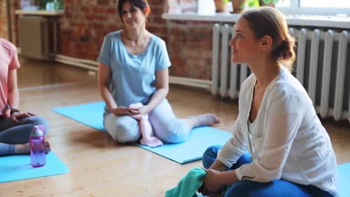 Fitness, Sport and Healthy Lifestyle Concept - Group of People in Yoga