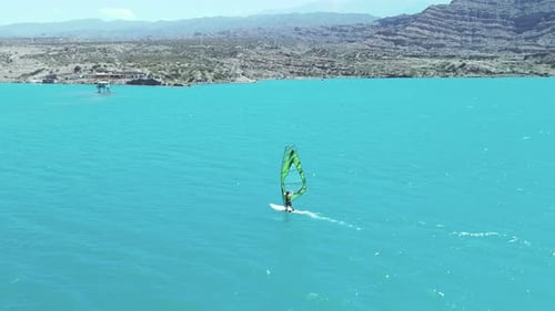 Aerial view of windsurfer on lake, Argentina.