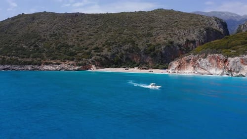 Aerial view of the Adriatic coast with speed boat. Tourists on summer holiday