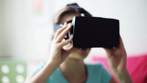 Young Girl Wears Virtual Reality Headset in Bedroom