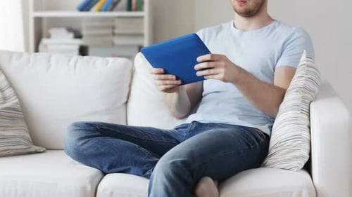 Technology, Lifestyle and People Concept - Close Up of Man Playing Game