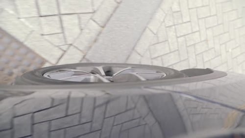 Camera mounted on side of a car filming the wheel