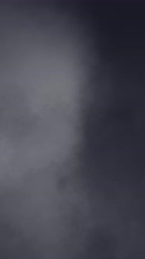 Slow Motion Smoke Clouds. Seamless Looping Animation. Vertical Video.