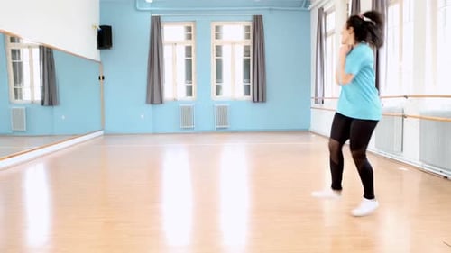 Loop. Dancer practices Twirking in a dance studio. Perfect loop. Locked off shot.