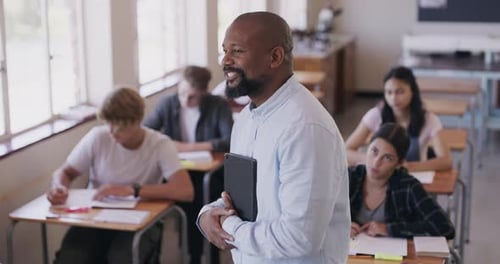 Smiling Teacher With Students in Classroom