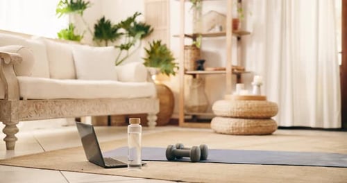 Home Fitness Setup with Yoga Mat and Dumbbells
