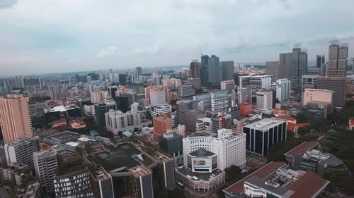 Aerial View of Singapore's Urban Landscape with Curved Facade Building