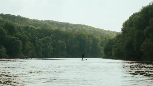 Paddleboarding Sport Activity For People In Summer Vacation Beautiful Landscape With River